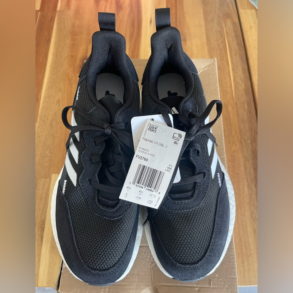 Black and white Adidas running shoes